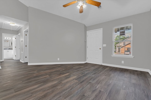 spare room with ceiling fan and dark hardwood / wood-style floors