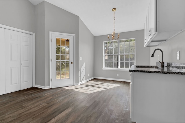 kitchen with pendant lighting, dark hardwood / wood-style floors, white cabinetry, and a wealth of natural light