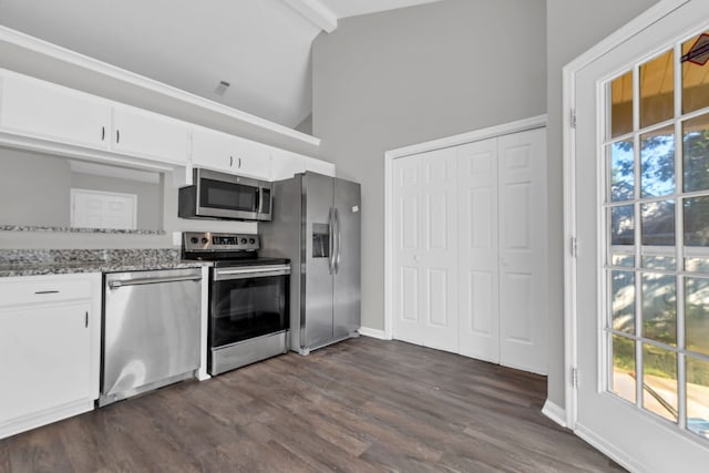 kitchen with white cabinets, stainless steel appliances, a wealth of natural light, and dark wood-type flooring