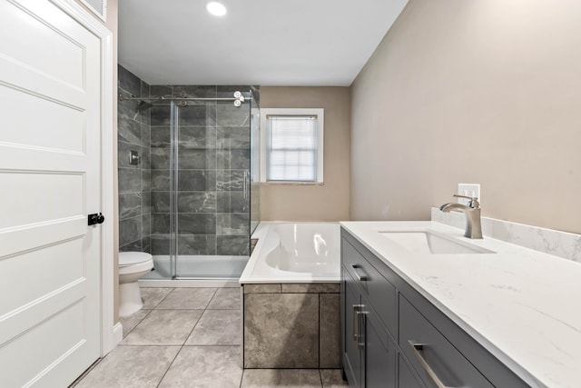 full bathroom featuring tile patterned flooring, vanity, toilet, and independent shower and bath