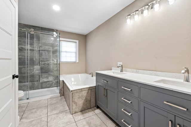 full bathroom featuring plus walk in shower, vanity, tile patterned floors, and toilet