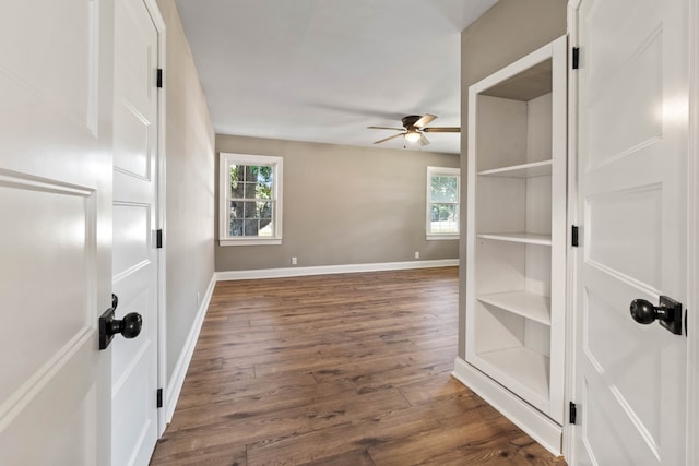 empty room featuring ceiling fan and dark hardwood / wood-style floors