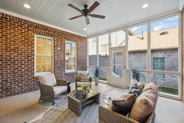 sunroom / solarium with ceiling fan and wood ceiling