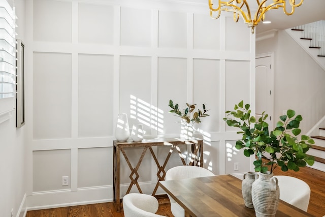 dining room with a notable chandelier and wood-type flooring