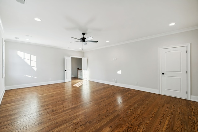 unfurnished room featuring ceiling fan, wood-type flooring, and ornamental molding