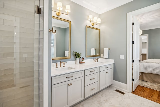 bathroom featuring crown molding, vanity, and hardwood / wood-style flooring