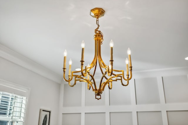 interior details featuring an inviting chandelier