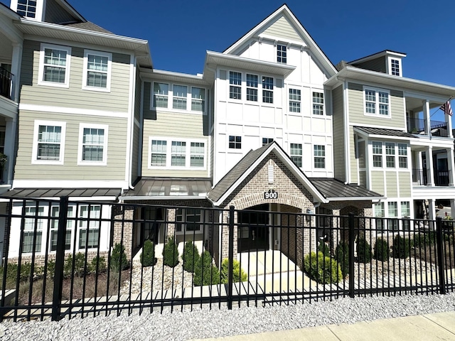 900 Vintage Green Ln Unit 301, Franklin, TN 37064 - view of front of home with a fenced front yard and board and batten siding