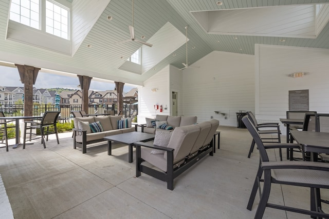 view of patio / terrace with ceiling fan and an outdoor living space