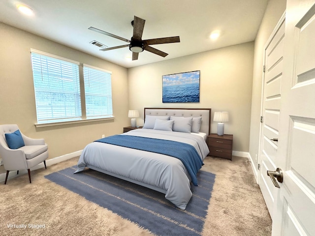 carpeted bedroom with ceiling fan