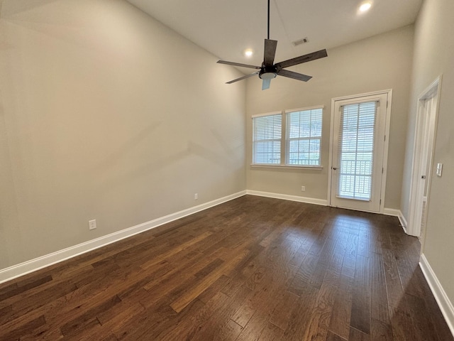 spare room featuring ceiling fan and dark hardwood / wood-style flooring