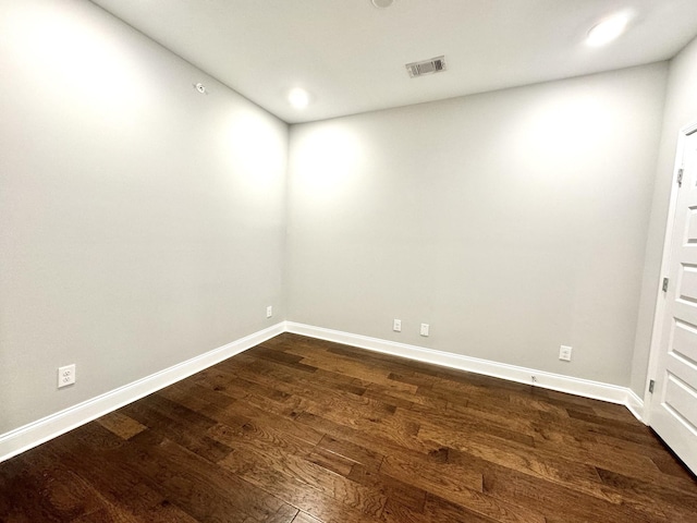 unfurnished room featuring dark hardwood / wood-style flooring