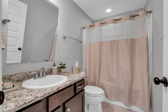 full bathroom featuring tile patterned flooring, vanity, toilet, and shower / tub combo with curtain