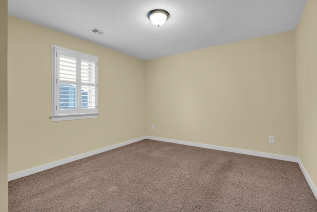 unfurnished room featuring carpet