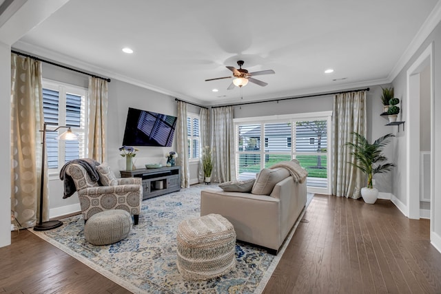 living room featuring crown molding, ceiling fan, and dark wood-type flooring