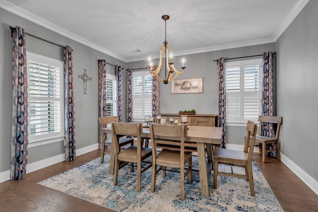 dining space featuring plenty of natural light, dark hardwood / wood-style floors, and crown molding