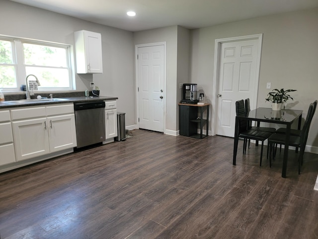 kitchen featuring white cabinetry, dishwasher, sink, and dark hardwood / wood-style floors