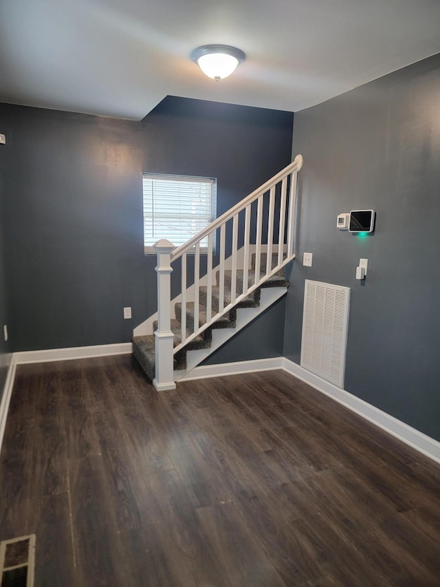 staircase featuring hardwood / wood-style flooring