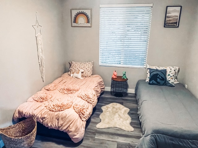 bedroom with hardwood / wood-style flooring