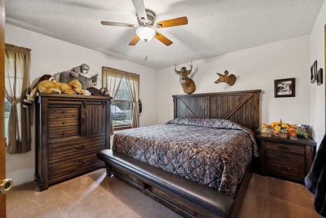 bedroom featuring carpet, ceiling fan, and a textured ceiling