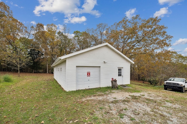 garage with a lawn