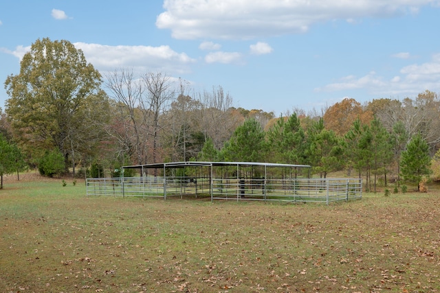 view of home's community with an outbuilding and a rural view