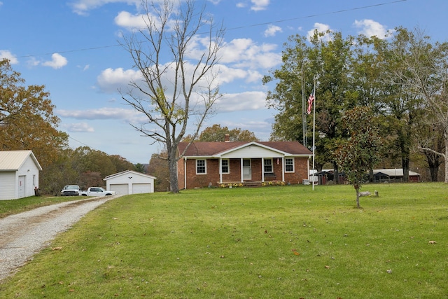 view of front facade with an outdoor structure, a porch, a front yard, and a garage