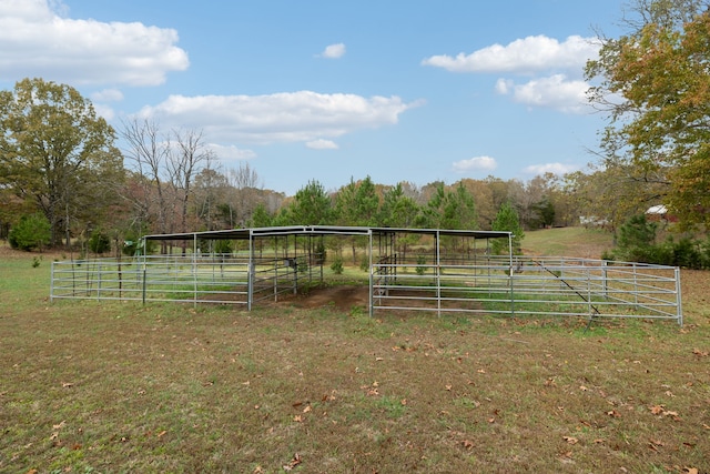 exterior space with a rural view and an outdoor structure