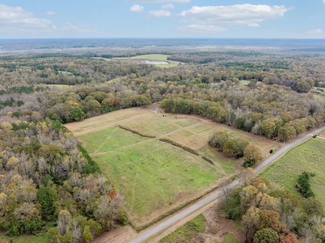 birds eye view of property with a rural view