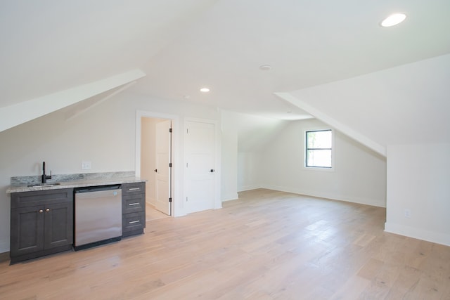 bonus room with light hardwood / wood-style flooring, lofted ceiling, and sink