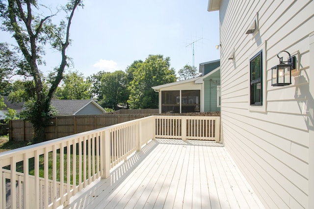 wooden terrace with a sunroom