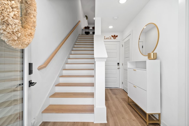 stairway featuring hardwood / wood-style floors