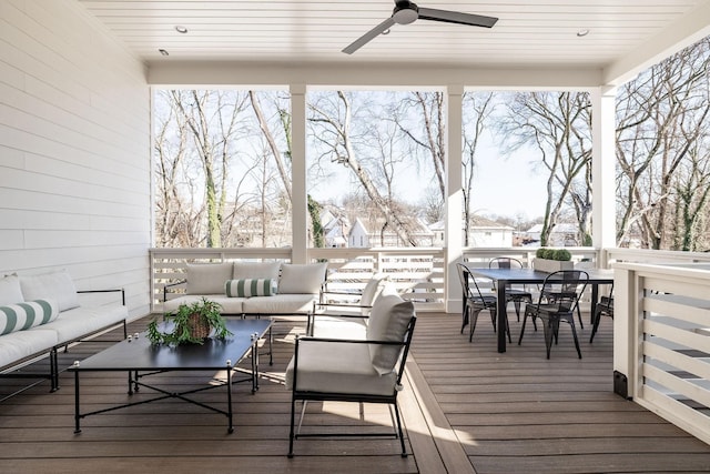 deck featuring ceiling fan and outdoor lounge area