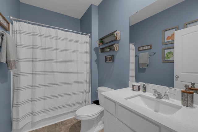 bathroom featuring a shower with shower curtain, vanity, and toilet