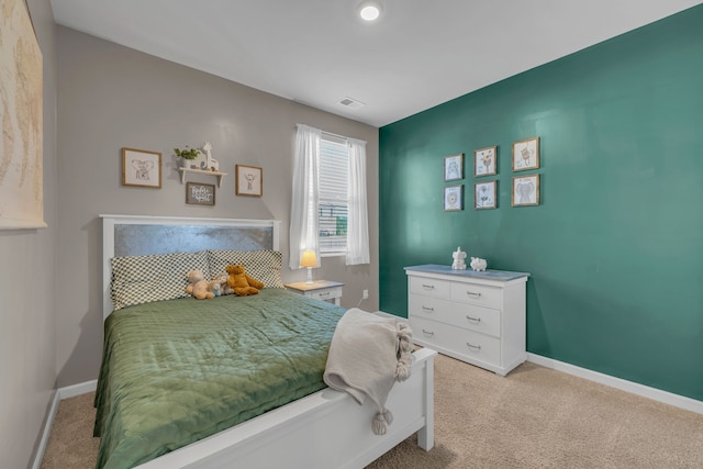 bedroom featuring light carpet