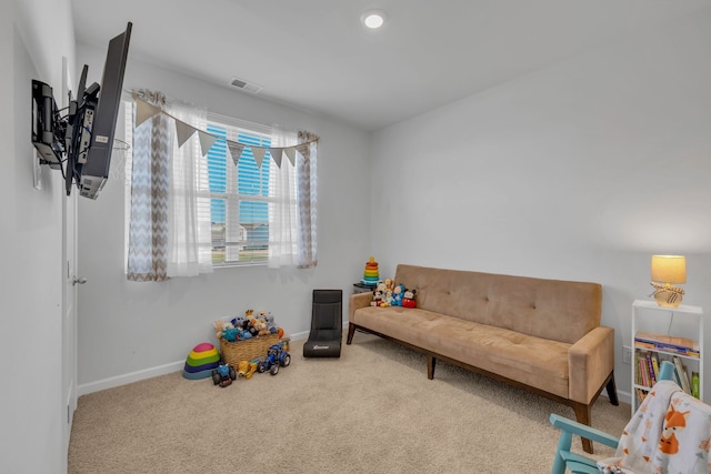 recreation room with carpet flooring