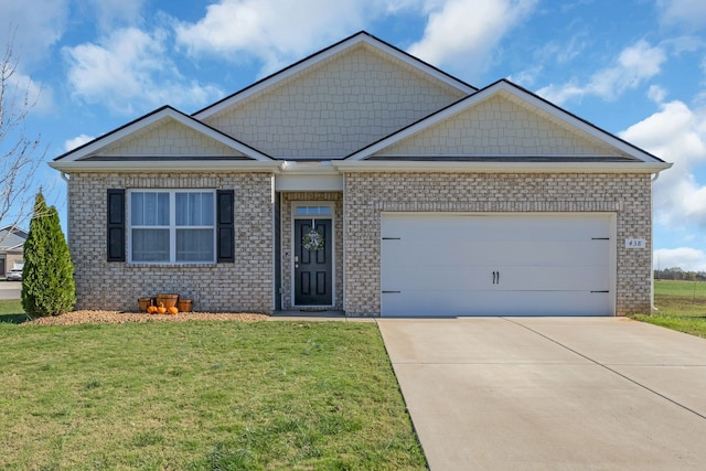 view of front of house with a front lawn and a garage