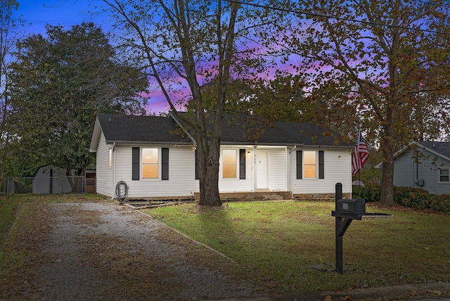 ranch-style house with a lawn