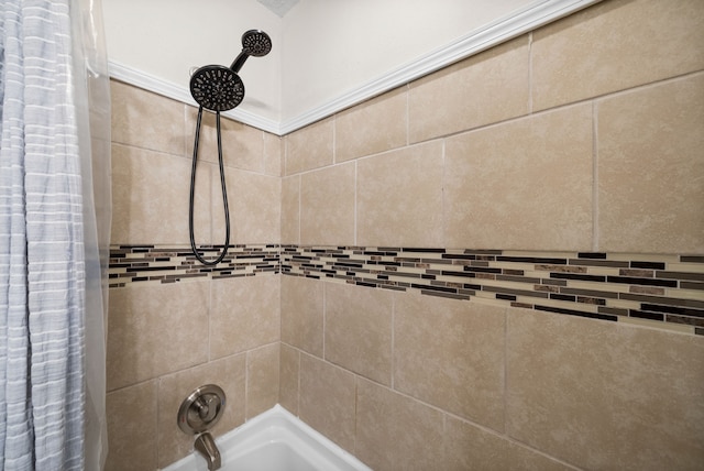 interior details featuring shower / bath combo