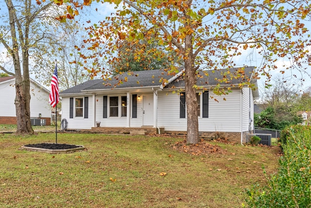 single story home featuring a front lawn and central air condition unit