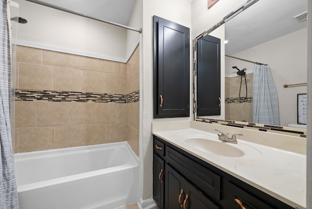 bathroom with shower / tub combo and vanity