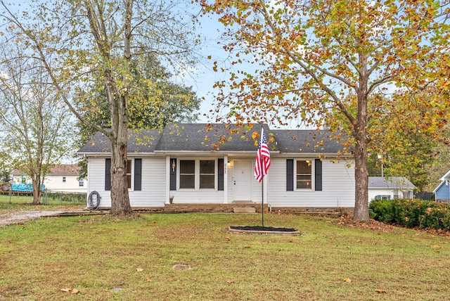 single story home featuring a front yard