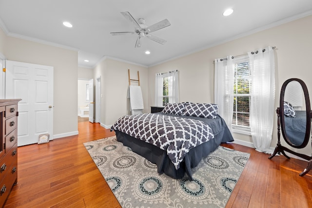 bedroom with ensuite bath, ceiling fan, light hardwood / wood-style flooring, and crown molding