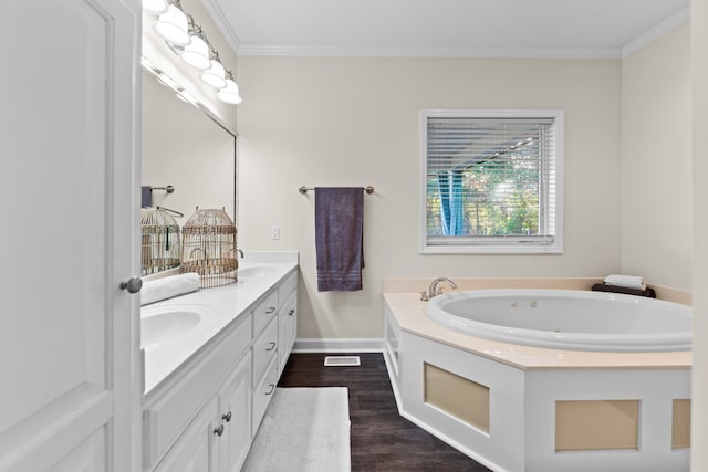 bathroom featuring a tub to relax in, vanity, wood-type flooring, and ornamental molding