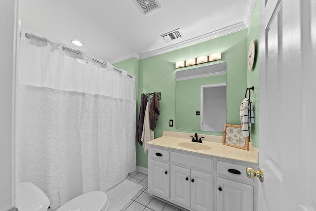 bathroom with tile patterned floors, vanity, toilet, and crown molding