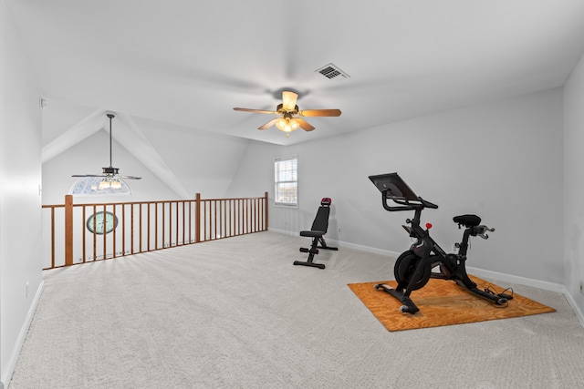 workout area featuring ceiling fan, light colored carpet, and lofted ceiling