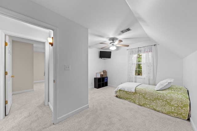 carpeted bedroom with ceiling fan and lofted ceiling