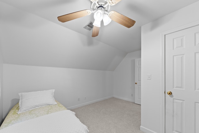 carpeted bedroom featuring ceiling fan and lofted ceiling