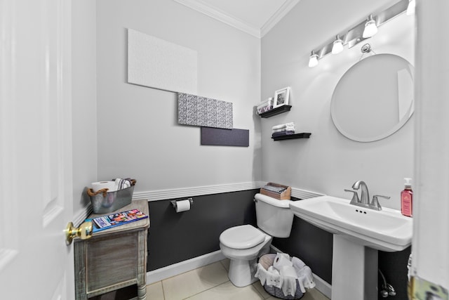 bathroom with toilet, tile patterned floors, and crown molding