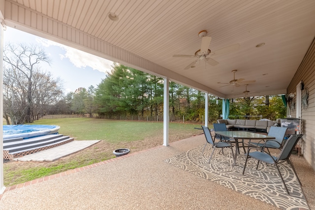 view of patio / terrace with ceiling fan and an outdoor living space